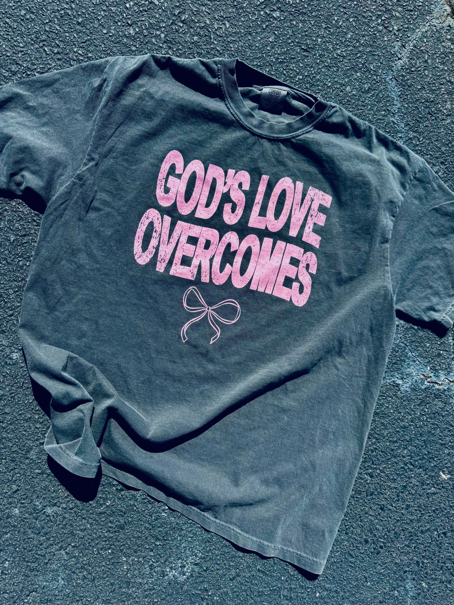 God's Love Overcomes graphic tee