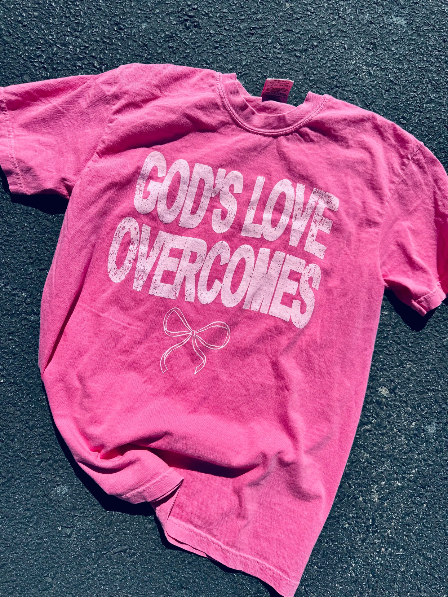 God's Love Overcomes graphic tee