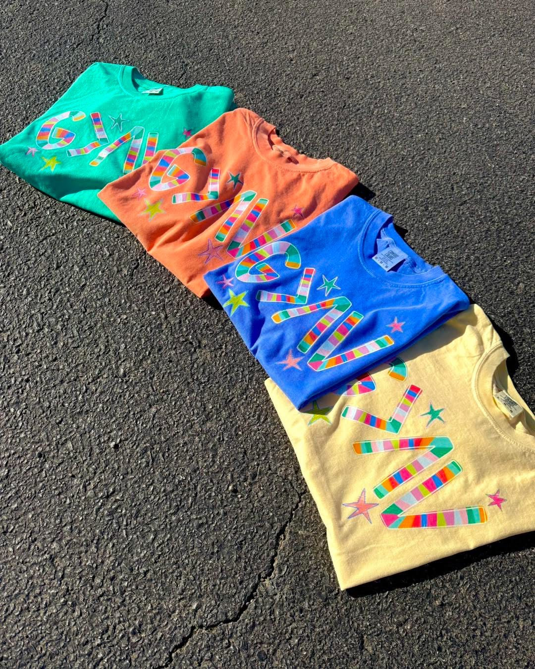 GOD IS GREATER THAN THE HIGHS AND THE LOWS GRAPHIC TEE | COLORS